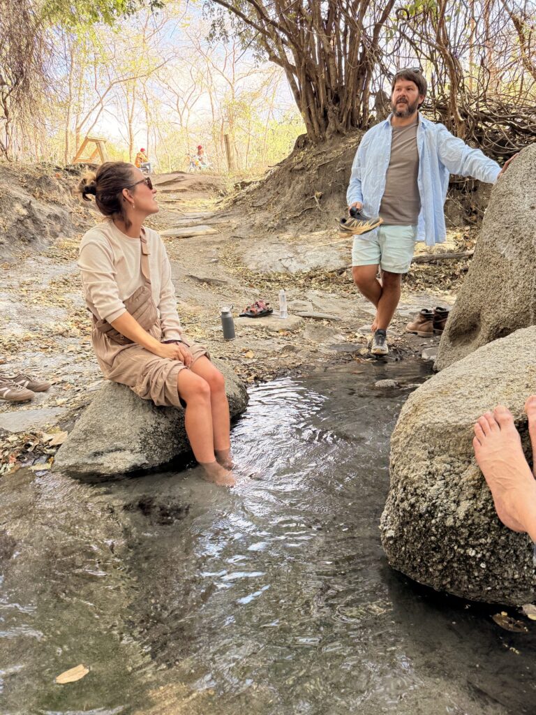 Resting with feet in the warm water at the Iringa hot springs at God's Bridge