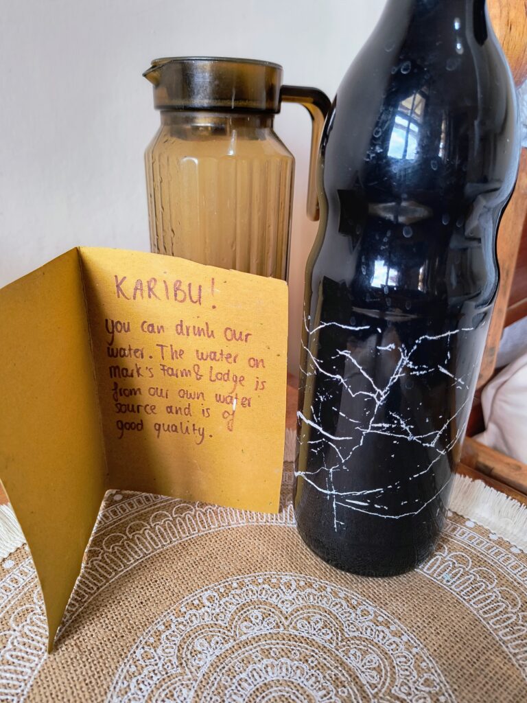 Handwritten Karibu note explaining the drinking water comes from our own source